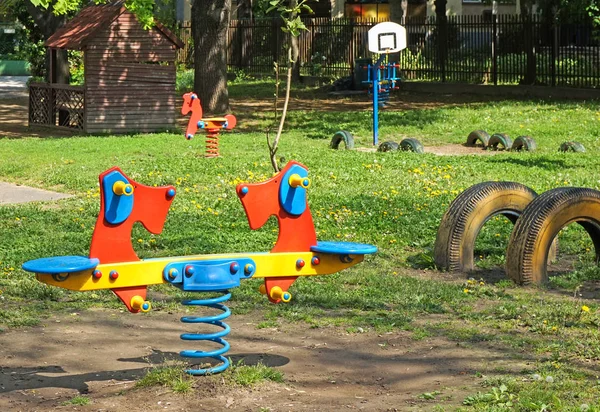 Toy swing on the yard of the kindergarten — Stock Photo, Image