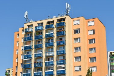 High apartment building with antennas clipart