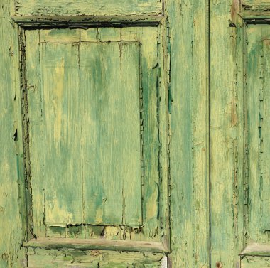 Eski yeşil ahşap bir kapının yüzeyi