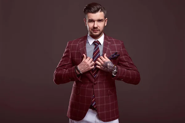 Portrait of elegant brutal man in a wool suit — Stock Photo, Image