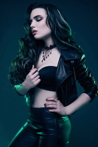 Young sexy girl with long hair in leather jacket — Stock Photo, Image