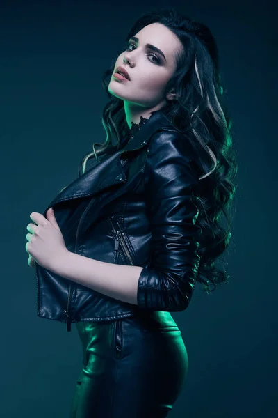 Young sexy girl with long hair in leather jacket — Stock Photo, Image