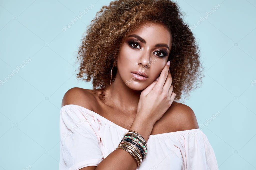 Glamour elegant black hippy woman model with curly hair