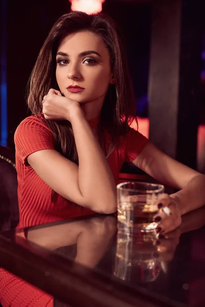 Gorgeous beauty young brunette woman in red dress with cigarette — Stock Photo, Image