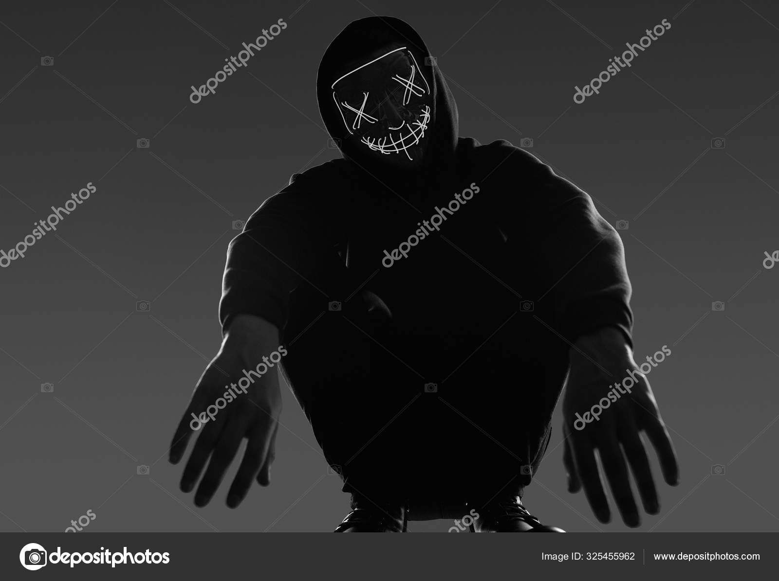 Download A Person Wearing A Neon Mask With A Hoodie Wallpaper