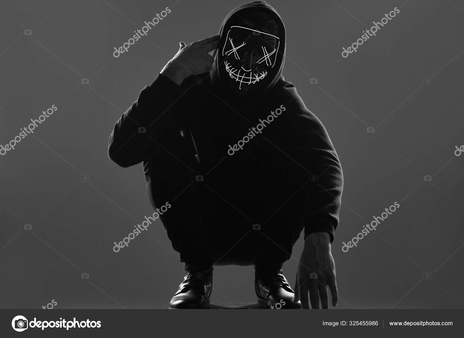 scary man in black hoodie