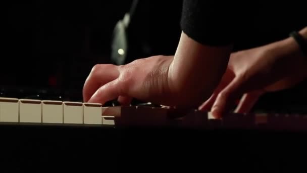 Hands of a musician who plays the piano in the studio — Stock Video