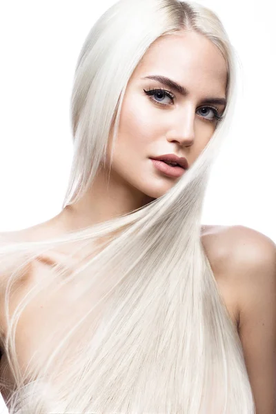 Beautiful blond girl in move with a perfectly smooth hair, and classic make-up. Beauty face. — Stock Photo, Image