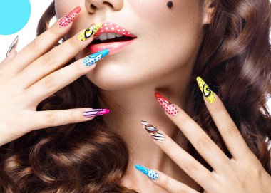 Photo of surprised young woman with professional comic pop art make-up and design manicure. Creative beauty style. clipart