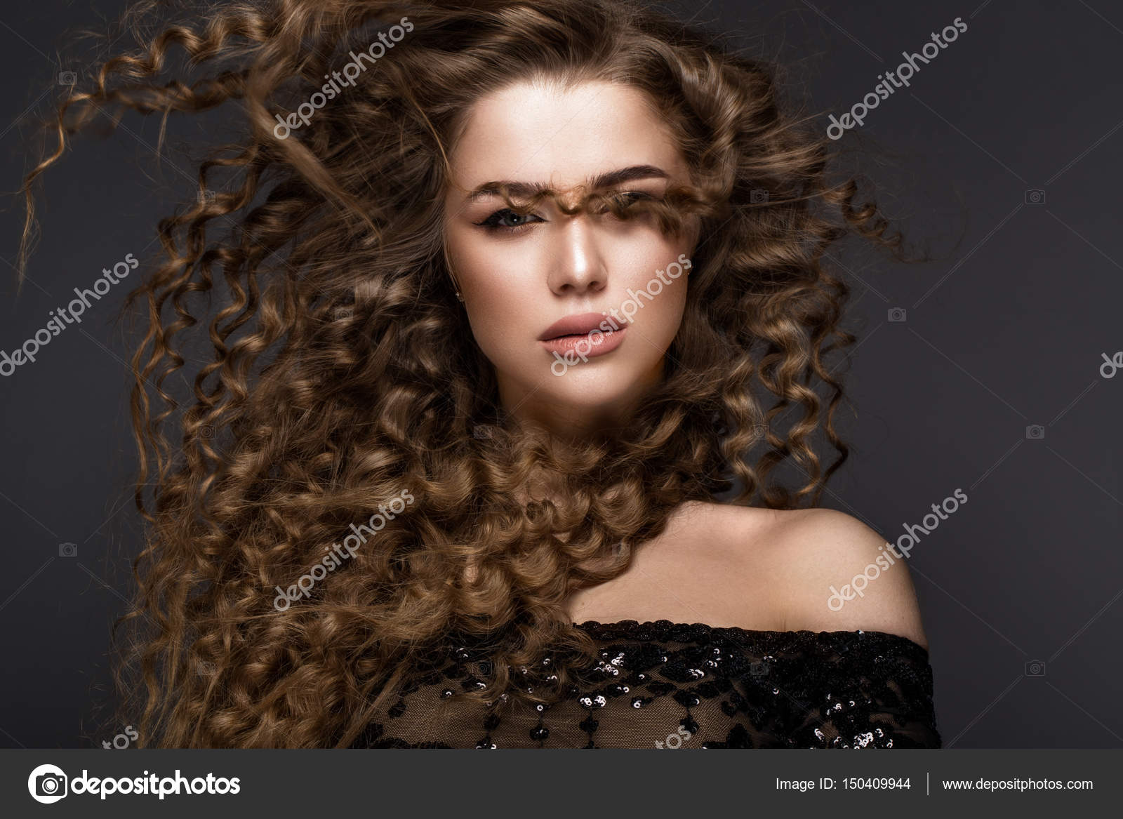 Beautiful Brunette Girl In Move With A Perfectly Curly Hair And