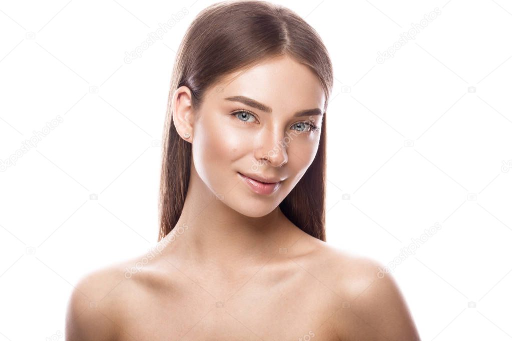 Beautiful young girl with a light natural make-up and perfect skin. Beauty face.