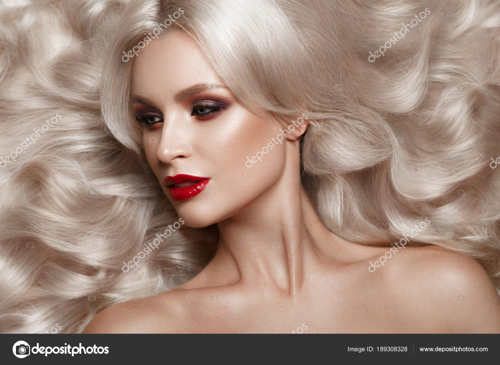 Beautiful Blonde In A Hollywood Manner With Curls Natural Makeup