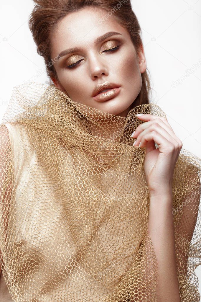 Beautiful sexy girl with sensual lips, fashion hair, gold dress and accessories. Beauty face.