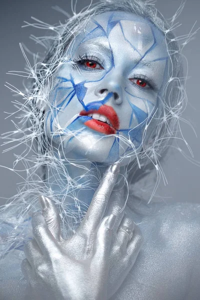 Beautiful girl in an unusual winter look with red lips. Creative make- up. Art look. — 스톡 사진