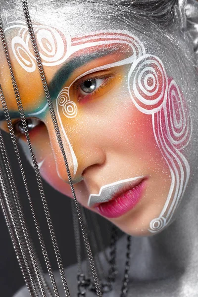 Beautiful girl in an unusual winter look with colorful face. Creative make- up. Art look. — 스톡 사진