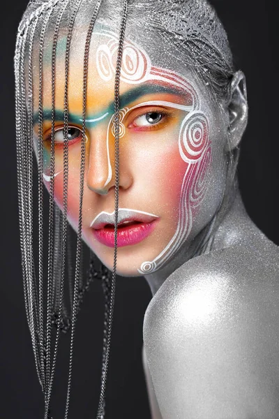 Beautiful girl in an unusual winter look with colorful face. Creative make- up. Art look. — 스톡 사진