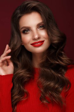Beautiful sexy woman with classic make-up, wave hair and red lips. Beauty face.