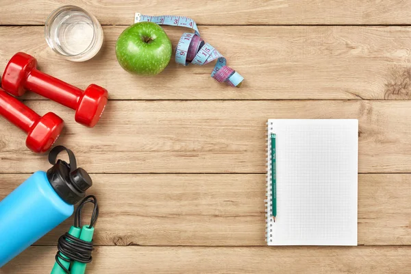 Healthy lifestyle, lose weight and sport concept. Athlete's equipment: red dumbbell, sport water bottles. Space for text — Stock Image Healthy lifestyle, lose weight and sport concept. Athlete's equipment: red dumbbell, sport water bottles. Space for text Stock Image