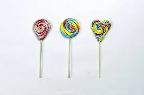 Rainbow color lollipops. colorful lollipop isolated on white background. Close up copy space. — Stock Photo, Image