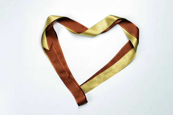 Red heart shaped ribbon isolated on white background. — Stock Photo, Image