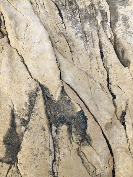 Giallo grunge roccia texture sfondo con cracks.yellow montagna texture primo piano. Superficie di pietra naturale incrinata — Foto Stock
