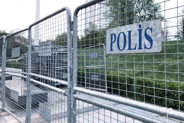 sign police in turkish language on mettalic borders barricades