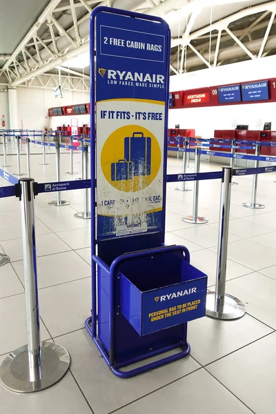Box to measure the size of hand Luggage into the cabin of the airline ryanair. Milan, Italy, June 2019