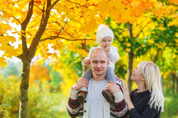 Family portrait against the background Indian summer. — Stock Photo, Image