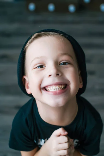 Portrait of an adorable young preschool boy in black cap. — Stock Photo, Image