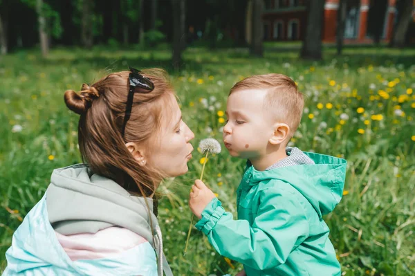 Happy Single Mother Son Blowing Dandelion Side View — Stock Photo, Image