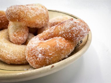 Zeppole, I 'deki karnavalı kutlamak için geleneksel kızarmış çörekler.