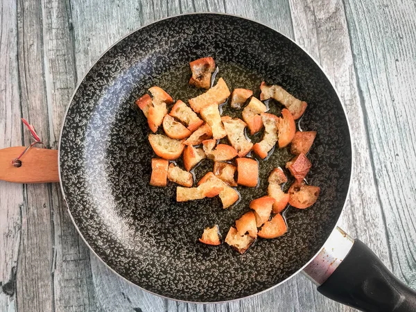 Frying bread chops for a traditionbal recipe in Puglia — 스톡 사진