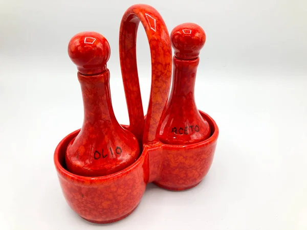 Salt and pepper dispenser in a red porcelain