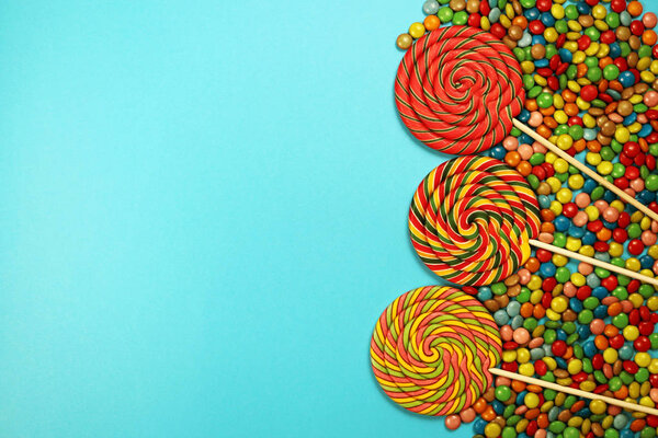  Colorful sweets and lollipops on blue background