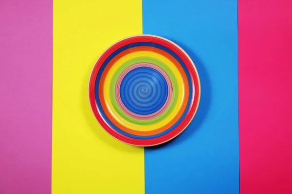 Bright Plate on multicolored background — Stock Photo, Image