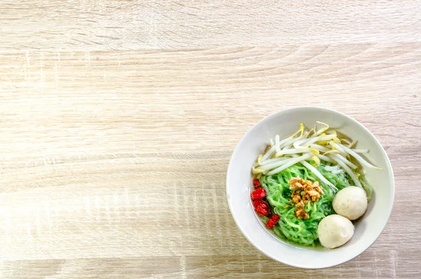 Thai Noodle with meat ball and crispy pork skin on wooden backgr — Stock Photo, Image