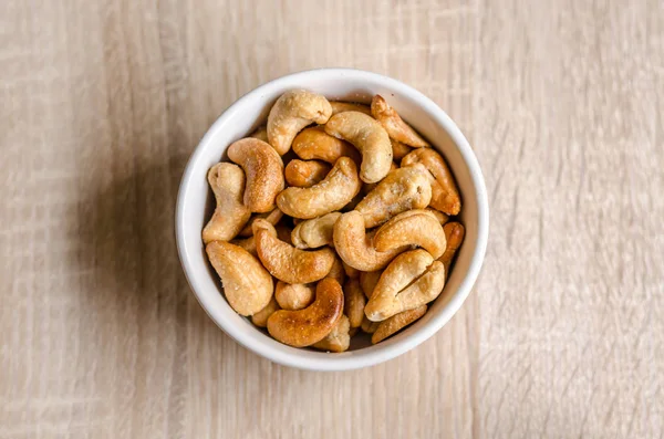 Close up cashew nuts on wooden background — Stock Photo, Image