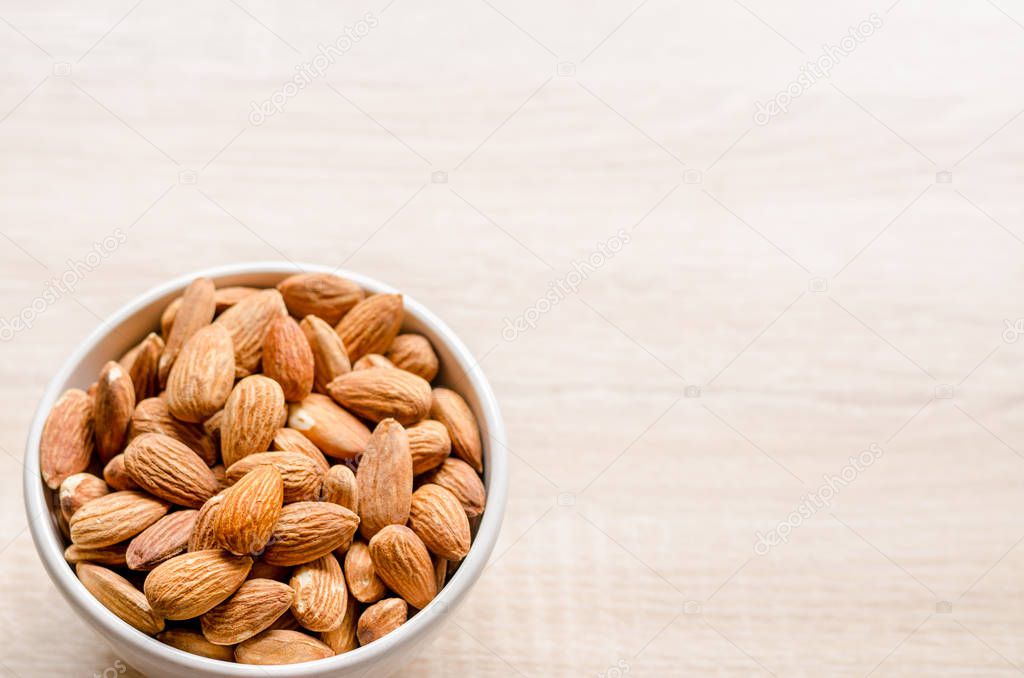 Almond Nuts on wooden background
