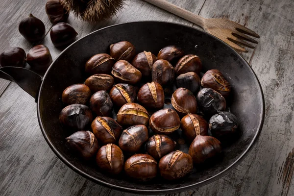 Roasted chestnuts cooked in a pot — Stock Photo, Image