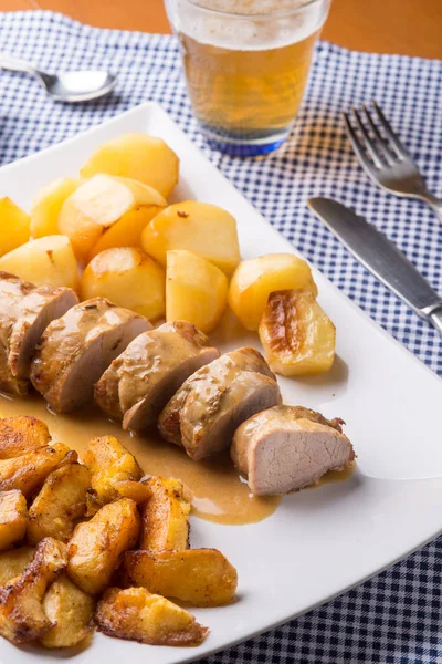 Sliced pork fillet served with potatoes — Stock Photo, Image