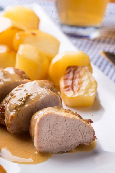 Sliced pork fillet served with potatoes — Stock Photo, Image