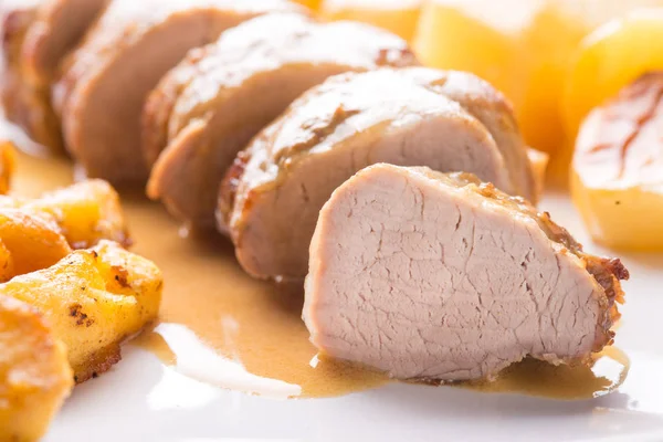 Sliced pork fillet served with potatoes — Stock Photo, Image