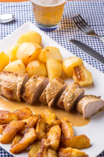 Sliced pork fillet served with potatoes — Stock Photo, Image