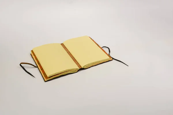 Vintage diary in brown leather cover on a white background — Stock Photo, Image