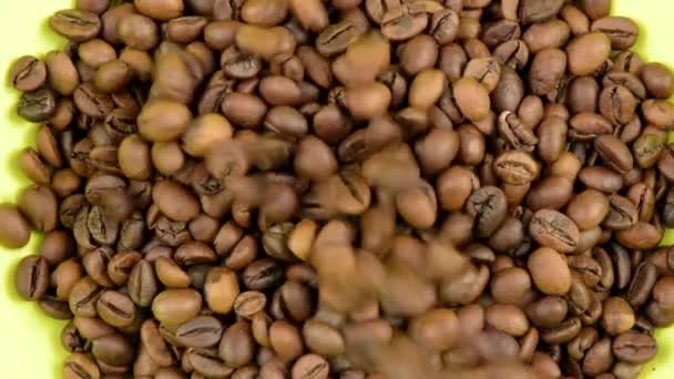 Slow Motion Roasted Coffee Beans Falling Green Plate Top View — Stock Video