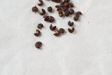 Macro photography of Timut pepper (Zanthoxylum armatum), from the same family as Sichuan Pepper. This spice delivers a very aromatic flavour close to grapefruit. clipart