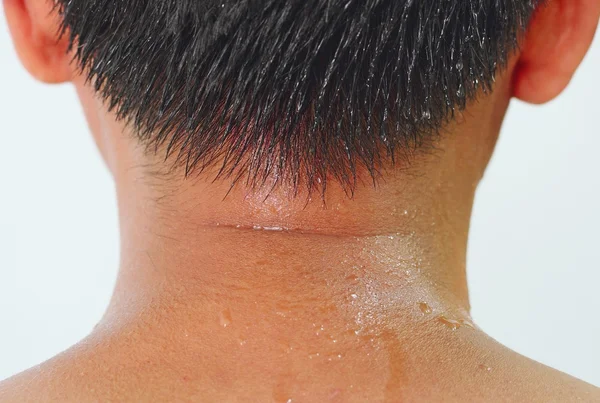 Pot na szyi azjatycki człowiek — Zdjęcie stockowe