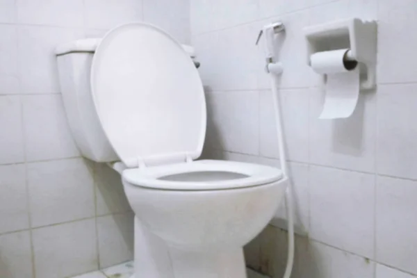 Blurred White toilet bowl in a bathroom — Stock Photo, Image