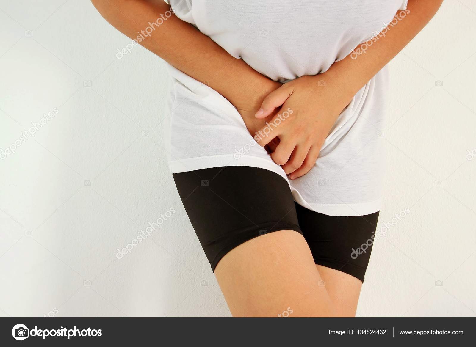 Close up of a woman with hands holding her crotch Stock Photo by ©Gap  134824432