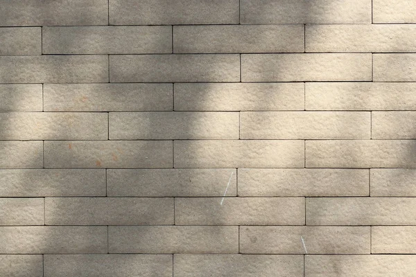 Bruine bakstenen muur patroon met schaduwen — Stockfoto